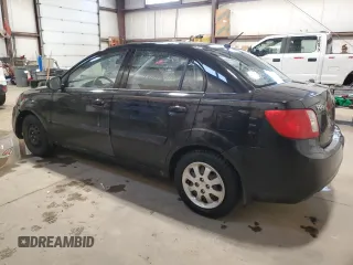 2010 Kia Rio with VIN KNADH4B37A6641845, listed as a Copart auction lot 51861215 with 163,894 mi miles and Salvage Title. Bid and sale history available at DreamBid. Image 2.