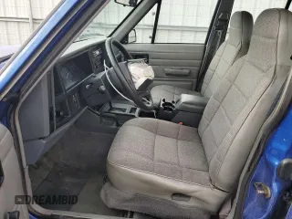1995 Jeep Cherokee SE with VIN 1J4FJ28S9SL667332, listed as a Copart auction lot 81849264 with 201,205 mi miles and Salvage Title. Bid and sale history available at carsss.com. Image 7.