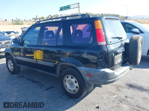 1999 Honda CR-V LX with VIN JHLRD284XXC018161, listed as a IAAI auction lot 41421514 with 209,066 mi miles. Bid and sale history available at carsss.com. Image 3.