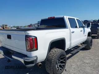 2017 GMC Sierra 1500 SLT z VIN 3GTU2NEC2HG474079, wystawiony jako IAAI lot #41899673 z przebiegiem 104 033 mil mil oraz . Historia ofert i sprzedaży dostępna na DreamBid. Obrazek 4.