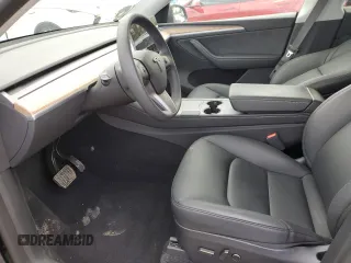 2024 Tesla Model Y with VIN 7SAYGDED1RA321691, listed as a Copart auction lot 52153945 with 7,544 mi miles and Salvage Title. Bid and sale history available at DreamBid. Image 7.