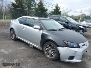 2012 Scion tC with VIN JTKJF5C73C3039072, listed as a IAAI auction lot 42042203 with 232,488 mi miles. Bid and sale history available at carsss.com. Image 1.
