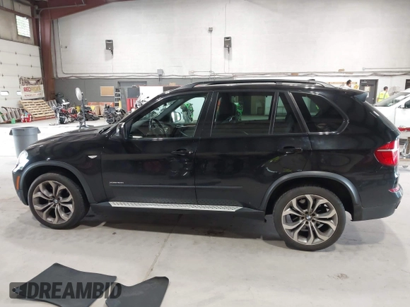 2012 BMW X5 50i with VIN 5UXZV8C50CL425721, listed as a IAAI auction lot 42590676 with 192,355 mi miles and . Bid and sale history available at DreamBid. Image 14.