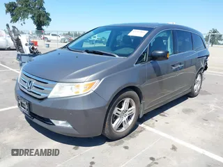 2012 Honda Odyssey Touring with VIN 5FNRL5H98CB011297, listed as a IAAI auction lot 42207061 with 154,073 mi miles and . Bid and sale history available at DreamBid. Image 2.