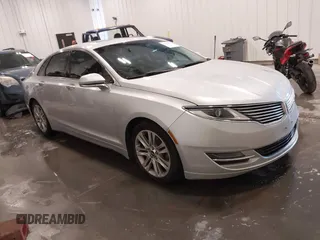 2016 Lincoln MKZ z VIN 3LN6L2G91GR606897, wystawiony jako IAAI lot #41946522 z przebiegiem 143 347 mil mil oraz . Historia ofert i sprzedaży dostępna na DreamBid. Obrazek 1.