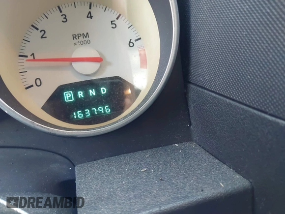 2009 Dodge Caliber SXT with VIN 1B3HB48A69D130857, listed as a IAAI auction lot 41526199 with 163,796 mi miles and . Bid and sale history available at DreamBid. Image 7.