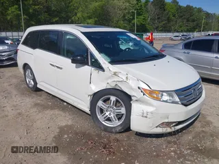 2013 Honda Odyssey Touring with VIN 5FNRL5H96DB009694, listed as a IAAI auction lot 42002487 with 182,867 mi miles and . Bid and sale history available at carsss.com. Image 1.