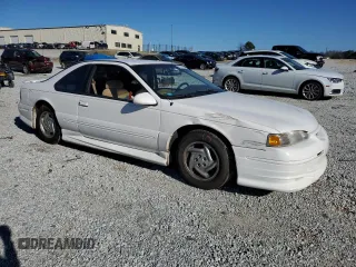 1997 Ford Thunderbird LX with VIN 1FALP62W0VH150654, listed as a Copart auction lot 86274524 with 119,203 mi miles and Salvage Title. Bid and sale history available at DreamBid. Image 4.