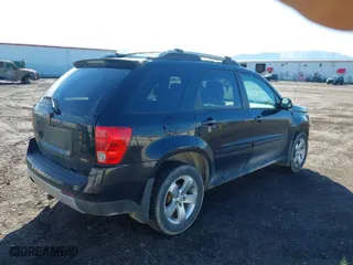 2006 Pontiac Torrent with VIN 2CKDL73F366166619, listed as a IAAI auction lot 41870221 with 123,469 mi miles. Bid and sale history available at carsss.com. Image 4.