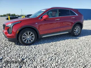 2020 Cadillac XT4 FWD Premium Luxury z VIN 1GYFZCR47LF040062, wystawiony jako Copart lot #52309415 z przebiegiem 12 517 mil mil oraz Szkody całkowita. Historia ofert i sprzedaży dostępna na DreamBid. Obrazek 1.