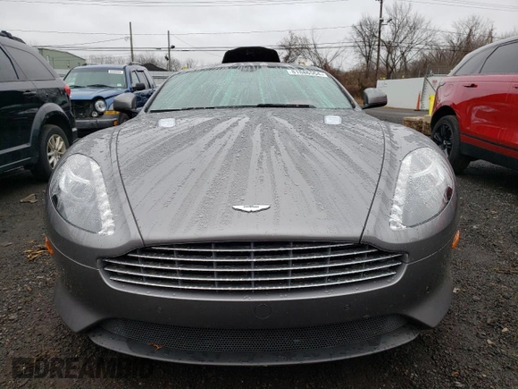 2015 Aston Martin DB9 z VIN SCFFDAEM9FGA16279, wystawiony jako Copart lot #81886554 z przebiegiem 25 029 mil mil oraz Szkoda całkowita • Salvage title. Historia ofert i sprzedaży dostępna na DreamBid. Obrazek 5.
