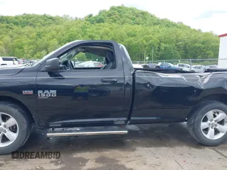 2021 Ram 1500 Tradesman with VIN 3C6JR7DT4MG704279, listed as a IAAI auction lot 42212201 with 21,528 mi miles and . Bid and sale history available at DreamBid. Image 14.