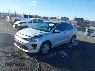 2023 Kia Rio LX with VIN 3KPA24ADXPE606463, listed as a IAAI auction lot 41728523 with 8,909 mi miles and . Bid and sale history available at DreamBid. Image 2.