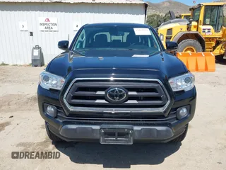 2023 Toyota Tacoma SR with VIN 3TMCZ5AN1PM654572, listed as a IAAI auction lot 42312575 with 14,111 mi miles and . Bid and sale history available at DreamBid. Image 12.