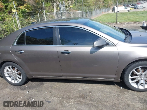 2012 Chevrolet Malibu LTZ with VIN 1G1ZG5E78CF298359, listed as a IAAI auction lot 42022284 with 141,295 mi miles and . Bid and sale history available at DreamBid. Image 14.