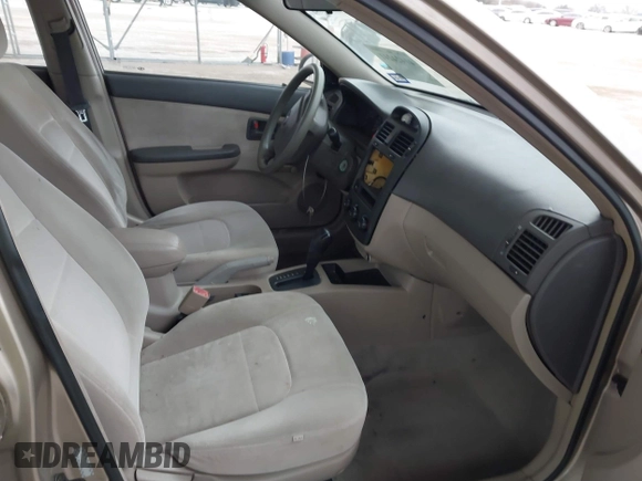 2004 Kia Spectra LX with VIN KNAFE121245064294, listed as a IAAI auction lot 41424241 with 110,136 mi miles. Bid and sale history available at carsss.com. Image 5.