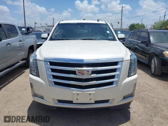 2015 Cadillac Escalade Luxury z VIN 1GYS4BKJ1FR215223, wystawiony jako IAAI lot #42548931 z przebiegiem 145 947 mil mil oraz . Historia ofert i sprzedaży dostępna na DreamBid. Obrazek 12.