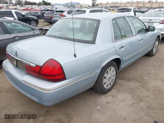 2005 Mercury Grand Marquis GS with VIN 2MEFM74W45X629662, listed as a IAAI auction lot 42075152 with 65,941 mi miles. Bid and sale history available at carsss.com. Image 4.