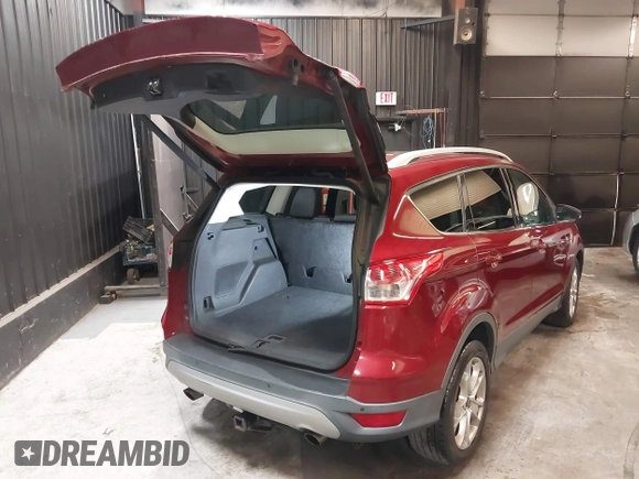 2014 Ford Escape Titanium with VIN 1FMCU9J9XEUD69589, listed as a IAAI auction lot 42031882 with 123,632 mi miles and . Bid and sale history available at DreamBid. Image 4.