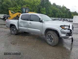 2023 Toyota Tacoma SR with VIN 3TMCZ5AN4PM566647, listed as a Copart auction lot 64062034 with 43,154 mi miles and Salvage title. Bid and sale history available at DreamBid. Image 4.