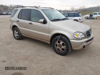 2002 Mercedes-Benz M-Class with VIN 4JGAB54E82A308902, listed as a IAAI auction lot 41779482 with 99,933 mi miles. Bid and sale history available at carsss.com. Image 1.