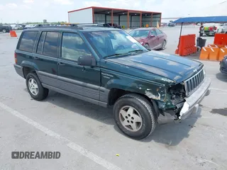 1995 Jeep Grand Cherokee Laredo z VIN 1J4FX58S0SC716398, wystawiony jako IAAI lot #42647346 z przebiegiem 58 184 mil mil oraz . Historia ofert i sprzedaży dostępna na DreamBid. Obrazek 1.