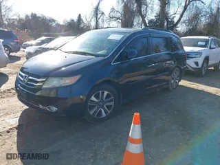 2014 Honda Odyssey Touring with VIN 5FNRL5H9XEB076185, listed as a IAAI auction lot 41512973 with 113,448 mi miles. Bid and sale history available at carsss.com. Image 18.