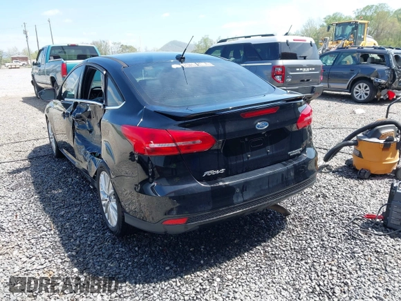 2016 Ford Focus Titanium z VIN 1FADP3J28GL393422, wystawiony jako IAAI lot #42075513 z przebiegiem 146 535 mil mil oraz . Historia ofert i sprzedaży dostępna na DreamBid. Obrazek 3.
