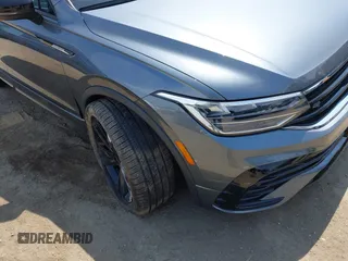 2023 Volkswagen Tiguan SE R-Line Black with VIN 3VVCB7AX8PM036684, listed as a IAAI auction lot 42169004 with 25,024 mi miles and . Bid and sale history available at DreamBid. Image 6.