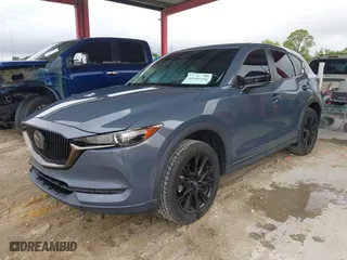 2021 Mazda CX-5 Touring with VIN JM3KFACM0M0327832, listed as a IAAI auction lot 41989199 with 42,396 mi miles. Bid and sale history available at carsss.com. Image 17.