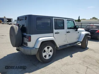 2007 Jeep Wrangler Unlimited Sahara with VIN 1J8GA59137L181360, listed as a Copart auction lot 62311225 with 151,393 mi miles and Salvage title. Bid and sale history available at DreamBid. Image 3.