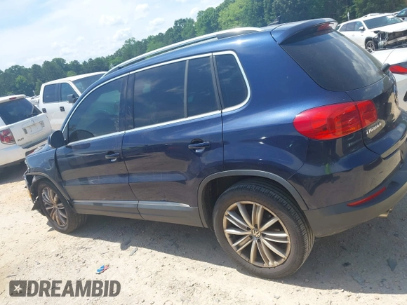 2012 Volkswagen Tiguan SE with VIN WVGAV7AX7CW534703, listed as a IAAI auction lot 42463358 with 119,699 mi miles and . Bid and sale history available at DreamBid. Image 14.
