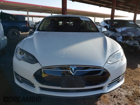 2014 Tesla Model S 60 with VIN 5YJSA1H14EFP63737, listed as a IAAI auction lot 41947610 with 62,240 mi miles and . Bid and sale history available at DreamBid. Image 12.
