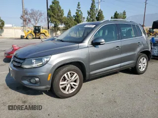 2013 Volkswagen Tiguan SE with VIN WVGAV7AX2DW023093, listed as a Copart auction lot 64694405 with 137,460 mi miles and Salvage title. Bid and sale history available at DreamBid. Image 1.