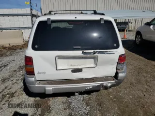 1996 Jeep Grand Cherokee Laredo with VIN 1J4FX58SXTC349575, listed as a Copart auction lot 80545584 with 302,636 mi miles and Salvage Title. Bid and sale history available at carsss.com. Image 6.