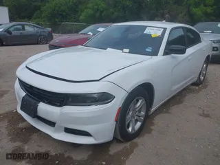2023 Dodge Charger SXT with VIN 2C3CDXBG2PH530257, listed as a IAAI auction lot 42067908 with 56,294 mi miles. Bid and sale history available at carsss.com. Image 2.