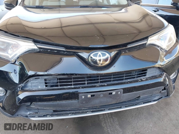 2018 Toyota RAV4 XLE with VIN 2T3WFREV2JW502622, listed as a IAAI auction lot 42327598 with 94,997 mi miles and . Bid and sale history available at DreamBid. Image 6.