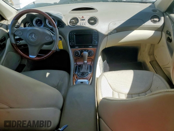 2009 Mercedes-Benz SL 550 with VIN WDBSK71F69F147589, listed as a Copart auction lot 65976995 with 77,387 mi miles and Salvage title. Bid and sale history available at DreamBid. Image 8.
