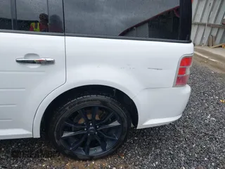 2017 Ford Flex SEL with VIN 2FMGK5C83HBA07084, listed as a IAAI auction lot 41921534 with 103,609 mi miles. Bid and sale history available at carsss.com. Image 6.