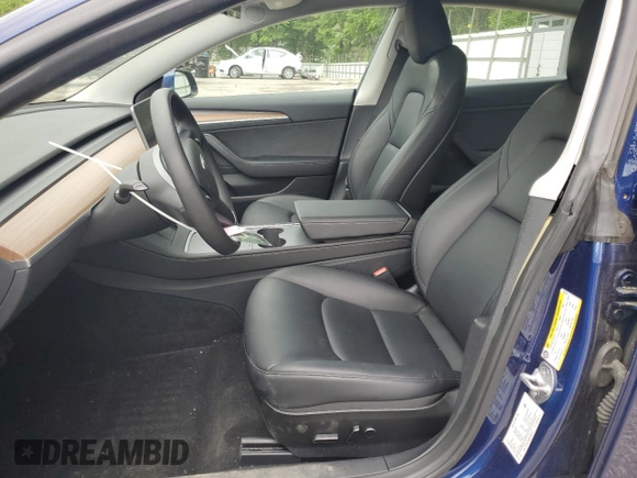 2023 Tesla Model 3 with VIN 5YJ3E1EA5PF695318, listed as a Copart auction lot 53832935 with 28,863 mi miles and Salvage title. Bid and sale history available at DreamBid. Image 7.