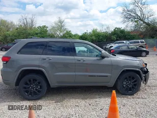 2021 Jeep Grand Cherokee Laredo E with VIN 1C4RJFAG4MC700384, listed as a IAAI auction lot 42192672 with 54,525 mi miles and . Bid and sale history available at DreamBid. Image 14.