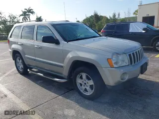 2007 Jeep Grand Cherokee Laredo with VIN 1J8GS48K77C545071, listed as a IAAI auction lot 41999998 with 144,966 mi miles. Bid and sale history available at carsss.com. Image 1.