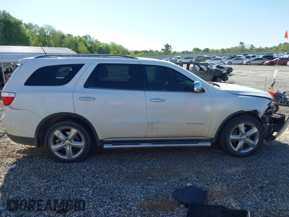 2013 Dodge Durango Citadel with VIN 1C4SDHET0DC571961, listed as a IAAI auction lot 42050261 with 257,637 mi miles and . Bid and sale history available at DreamBid. Image 13.
