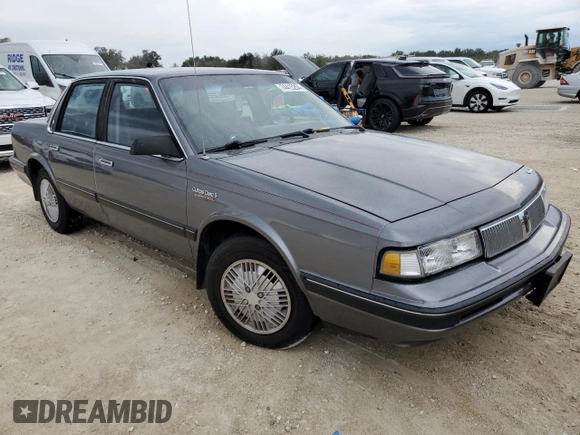 1992 Oldsmobile Cutlass z VIN 1G3AL54N4N6438104, wystawiony jako Copart lot #74415204 z przebiegiem 118 459 mil mil oraz Szkody całkowita. Historia ofert i sprzedaży dostępna na DreamBid. Obrazek 4.