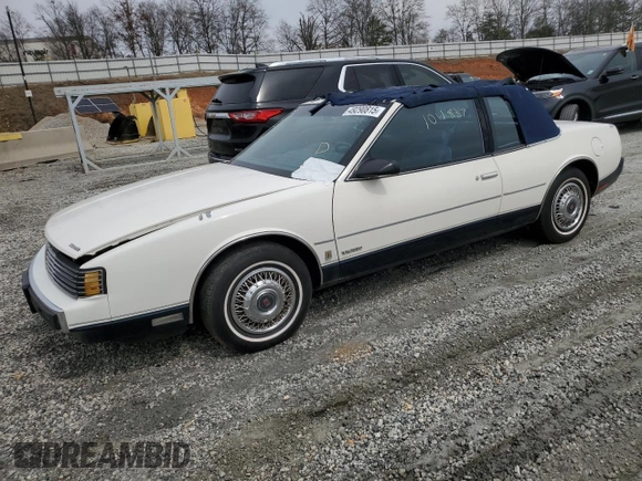 1987 Oldsmobile Toronado with VIN 1G3EZ1130HU307201, listed as a Copart auction lot 49290815 with 104,837 mi miles and Salvage Title. Bid and sale history available at DreamBid. Image 1.