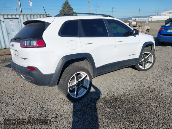 2021 Jeep Cherokee Trailhawk with VIN 1C4PJMBX9MD105888, listed as a IAAI auction lot 42065175 with 55,469 mi miles and . Bid and sale history available at DreamBid. Image 4.