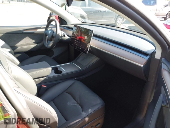 2024 Tesla Model Y Long Range with VIN 7SAYGDEE9RF199805, listed as a IAAI auction lot 42018221 with 7,359 mi miles. Bid and sale history available at carsss.com. Image 5.