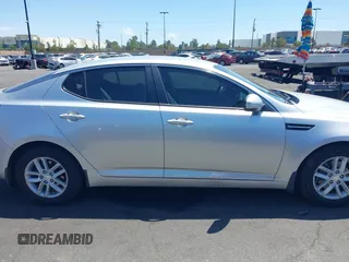 2013 Kia Optima LX z VIN KNAGM4A7XD5389662, wystawiony jako IAAI lot #42265945 z przebiegiem 164 488 mil mil oraz . Historia ofert i sprzedaży dostępna na DreamBid. Obrazek 13.