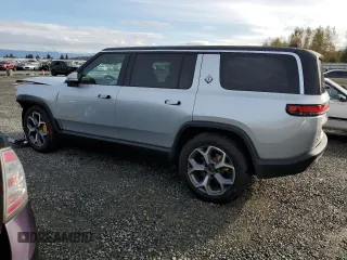 2023 Rivian R1S Adventure z VIN 7PDSGABAXPN019516, wystawiony jako Copart lot #73248104 z przebiegiem 11 525 mil mil oraz Szkody całkowita. Historia ofert i sprzedaży dostępna na DreamBid. Obrazek 2.