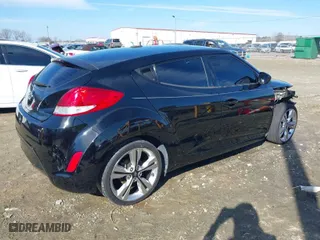 2017 Hyundai Veloster with VIN KMHTC6AD1HU321280, listed as a IAAI auction lot 41294268 with 59,139 mi miles. Bid and sale history available at carsss.com. Image 4.